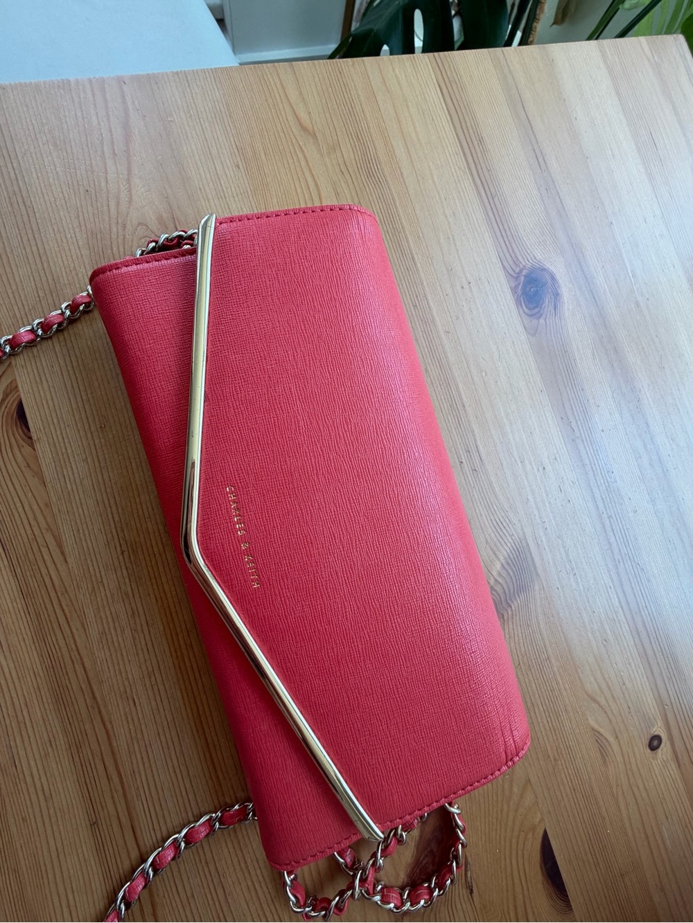 Charles & Keith Coral Clutch with Gold Accent Chain